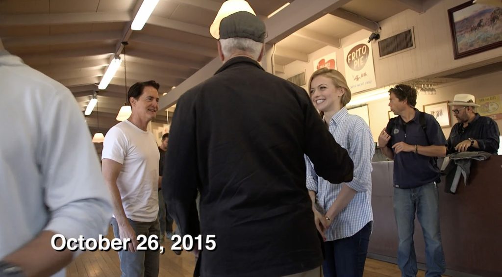 Three people inside a restaurant