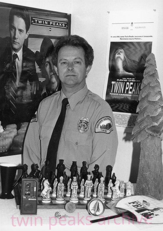 Bruce Phillips in a Twin Peaks Sheriff's Department outfit with props from the show