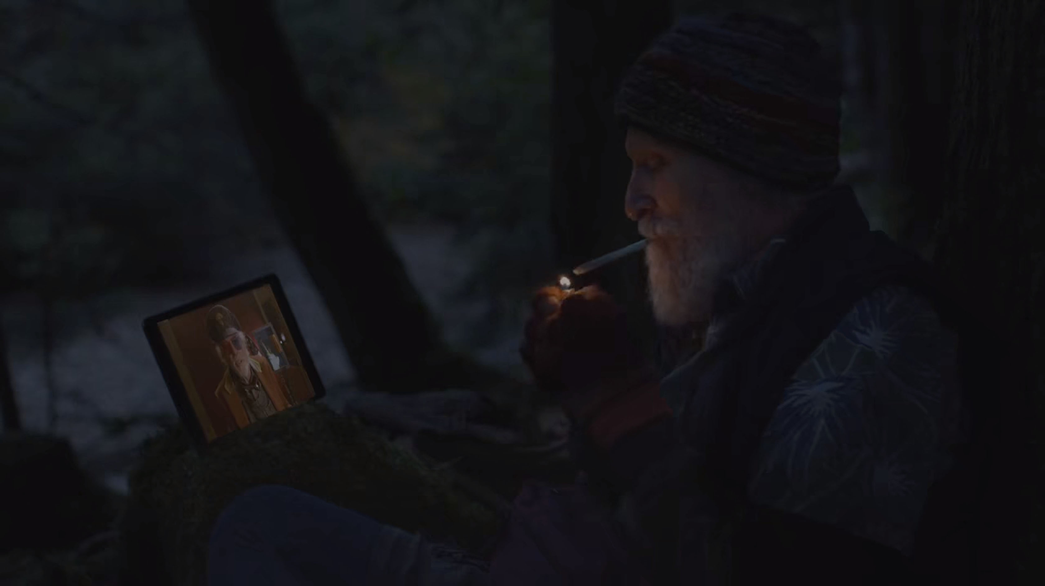 Jerry Horne in the woods smoking and watching Dr. Amp