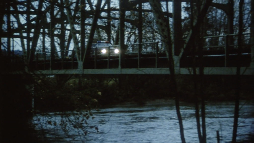 Missing Piece - Atmospheric Scene - Sheriff's Vehicle on Bridge