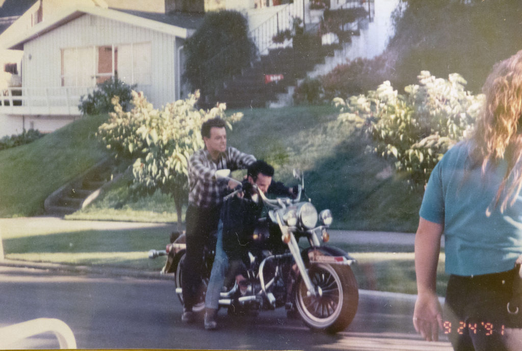 Ray Wise and James Marshall on the Harley Davidson motorcycle