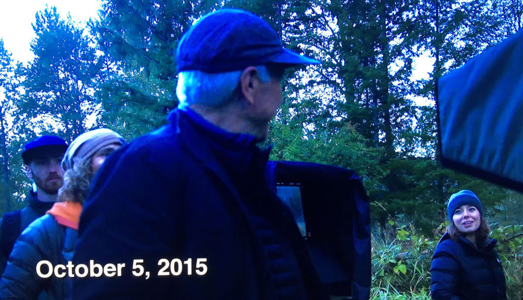 David Lynch talking to crew in woods