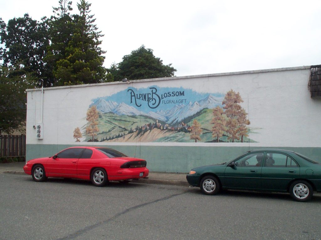 Side view of Alpine Blossom and Gift Shoppe with decorative mural