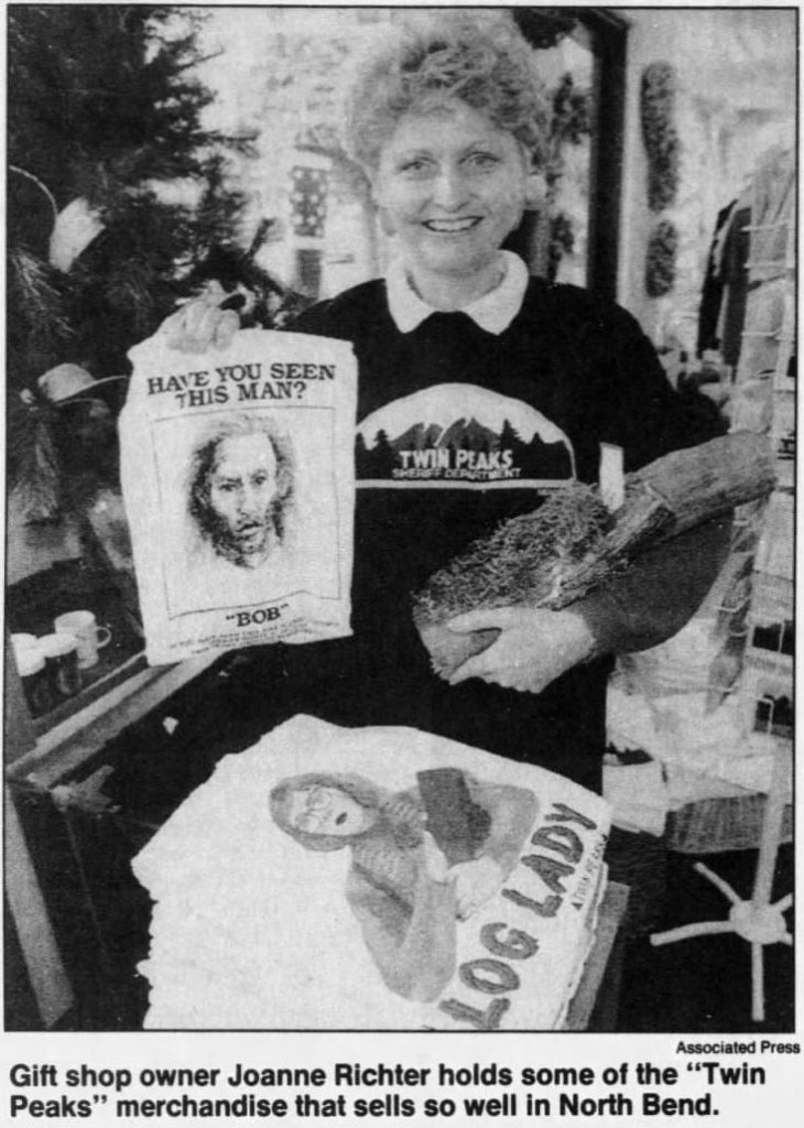 Photo of woman holding Twin Peaks merchandise