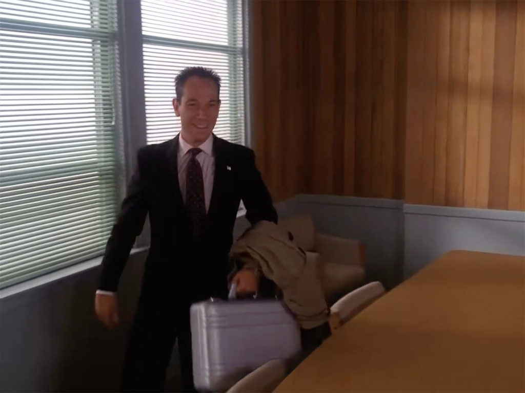 Agent Albert Rosenfield packing up his silver briefcase at the Twin Peaks Sheriff's Department