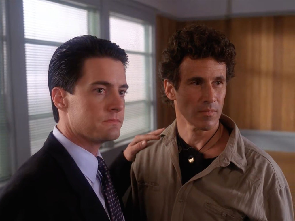 Agent Cooper and Sheriff Truman watch Albert Rosenfield leave the room