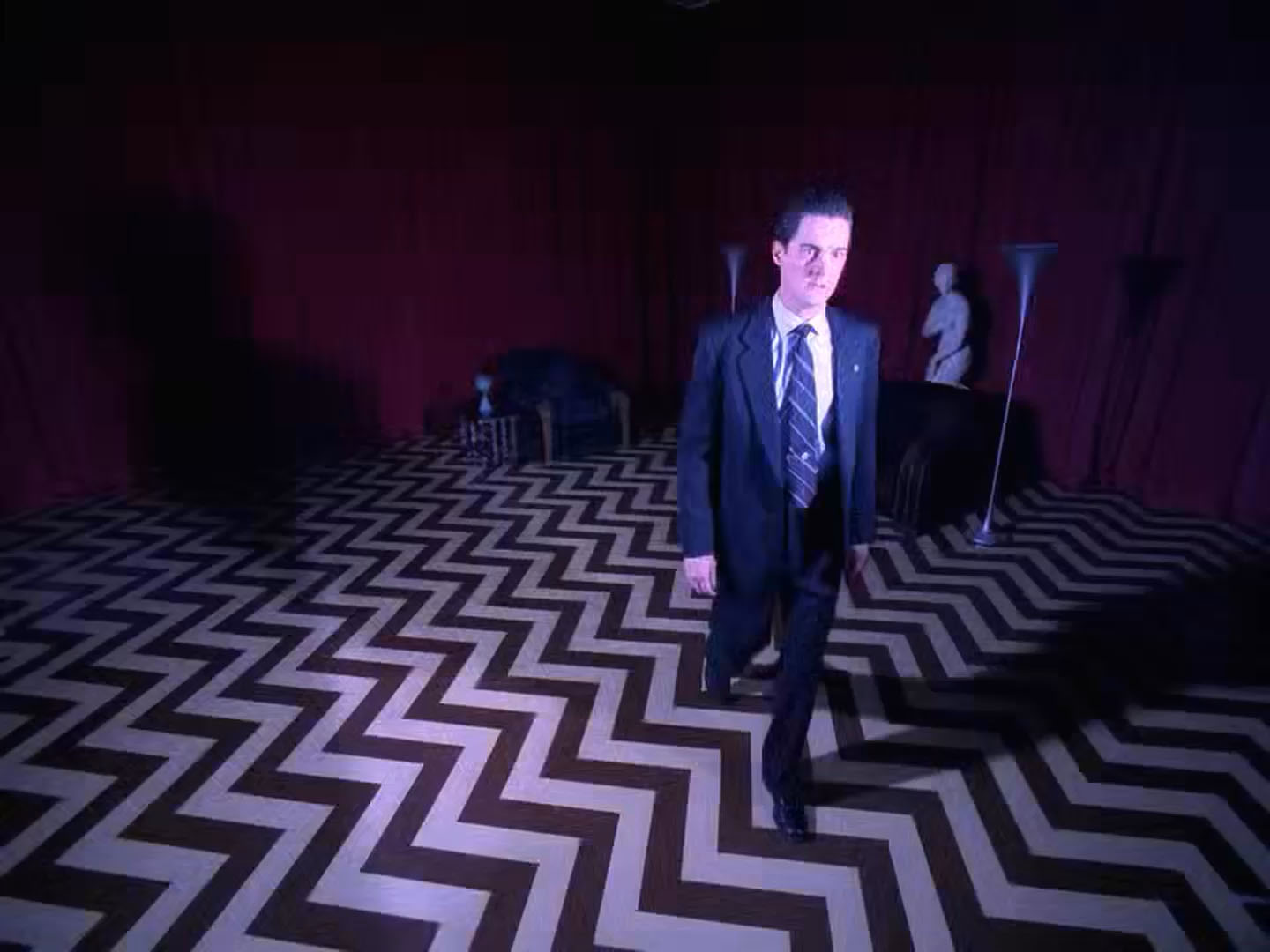 Agent Dale Cooper walking through the Red Room