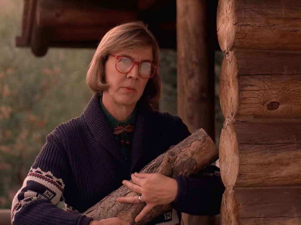 Log Lady holding The Log