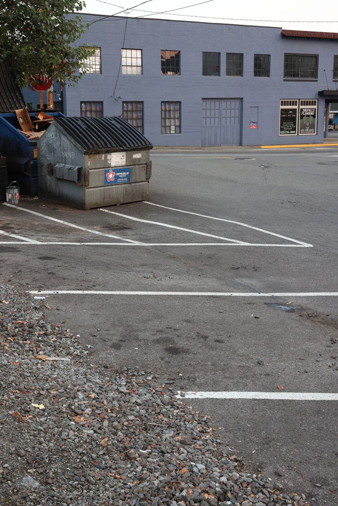 Dumpster and parking lot behind Twede's Cafe