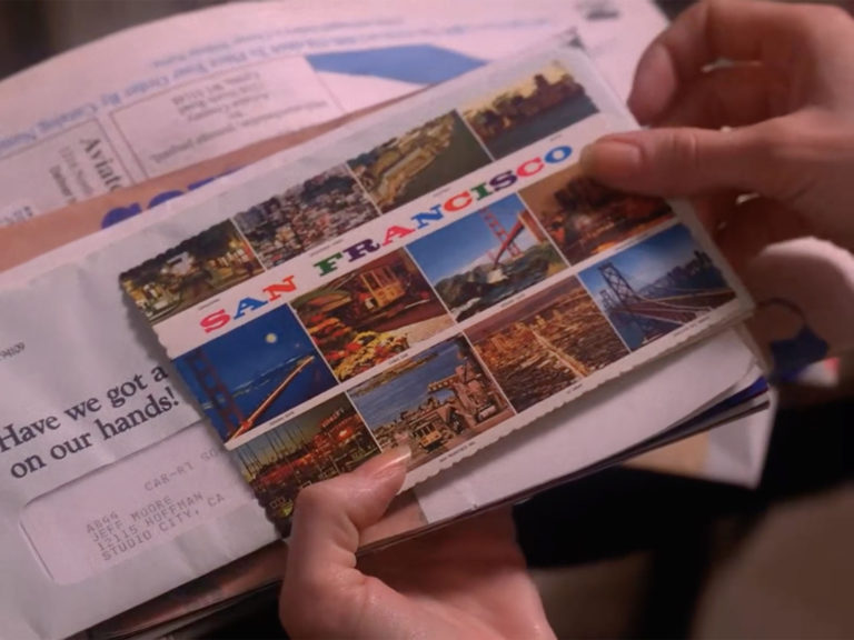 Donna Hayward holding a postcard from James Hurley