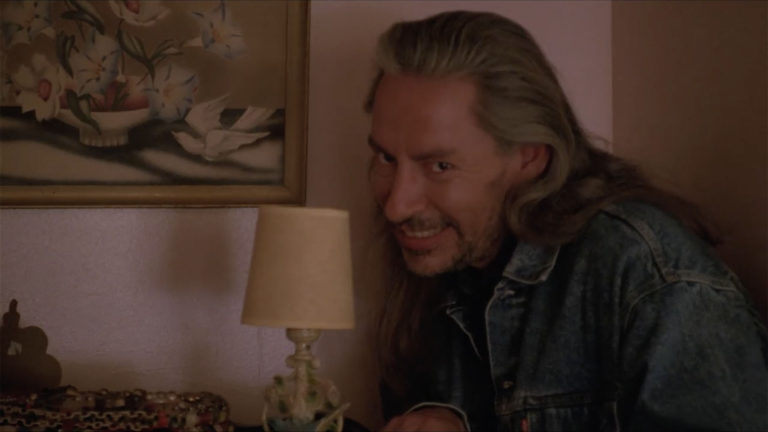 Bob standing next to a dresser in Laura Palmer's bedroom