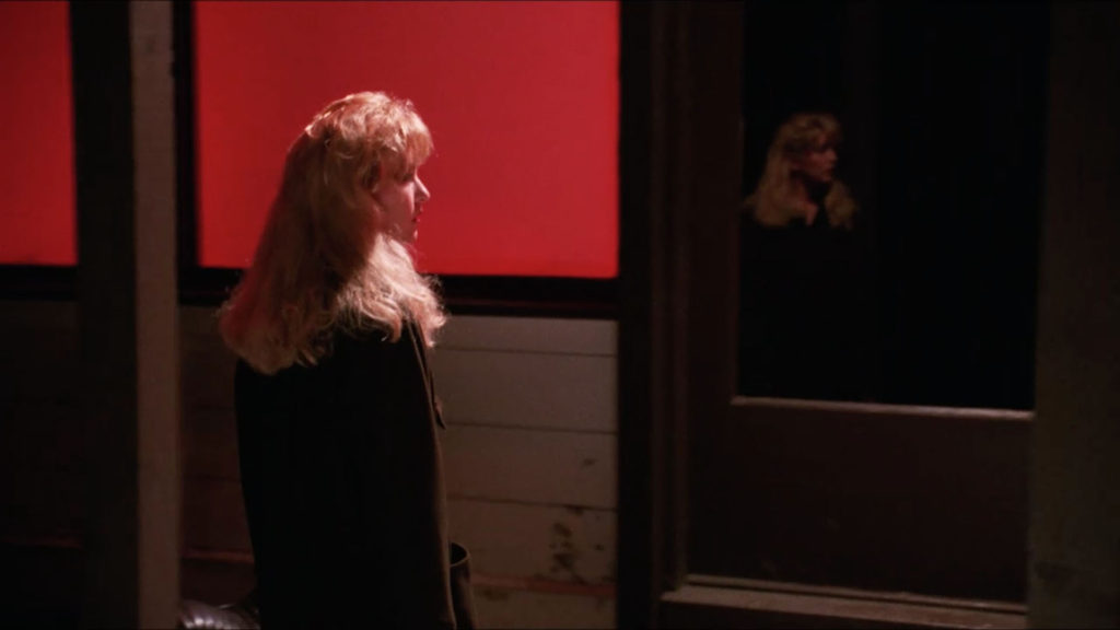 Laura Palmer standing next to the Roadhouse