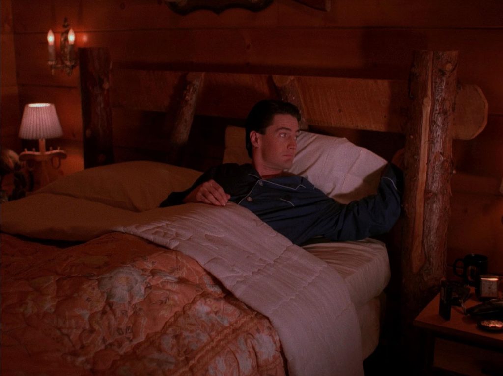 Dale Cooper lying in bed in Room 315 at the Great Northern Hotel