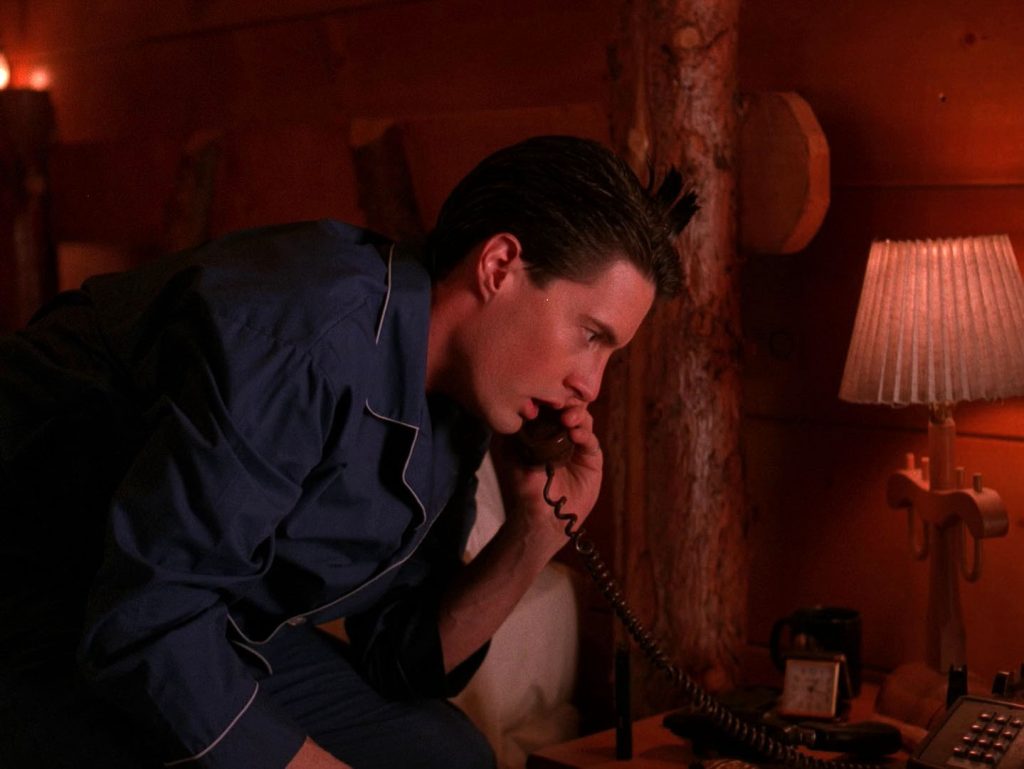 Dale Cooper speaking on the telephone in his room at the Great Northern Hotel