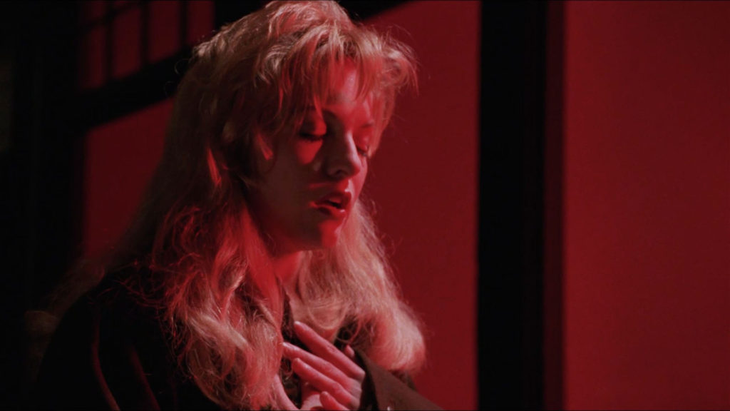 Laura Palmer touching her chest