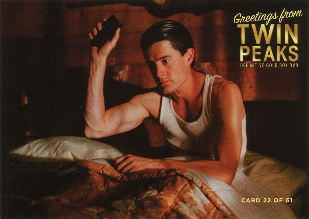 Greetings from Twin Peaks DVD Postcards Person sitting in bed holding up a handheld tape recorder