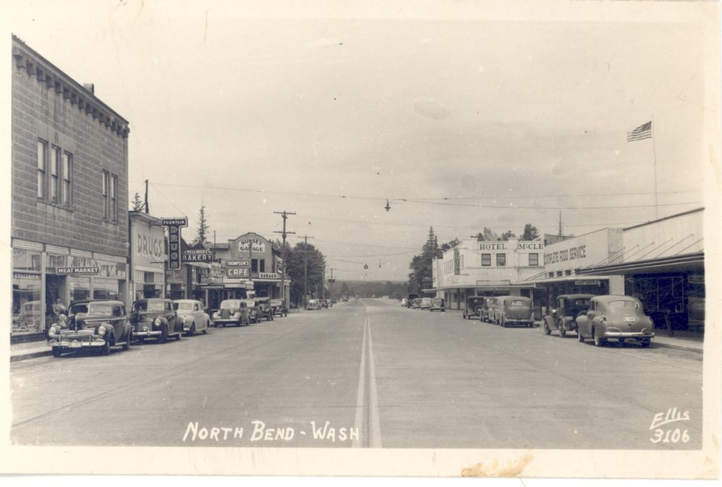 Black and white image of downtown North Bend, WA with buildings lining the street