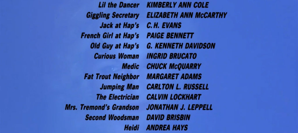 Film credits to David Lynch's "Twin Peaks - Fire Walk With Me." The actor credits are listed in black over a blue image with a ghosted image of Laura Palmer.