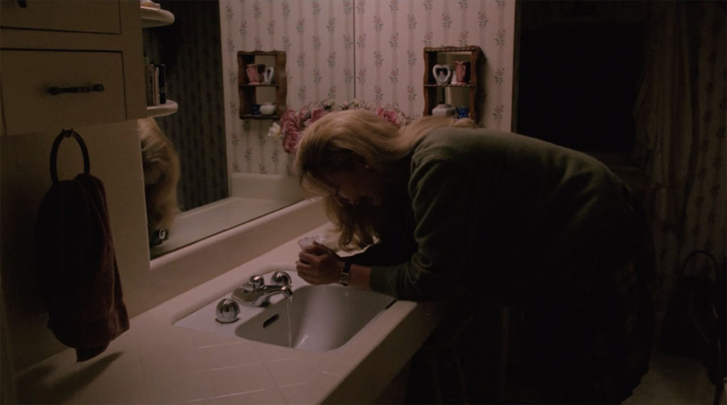 Laura Palmer washing her hands in the bathroom