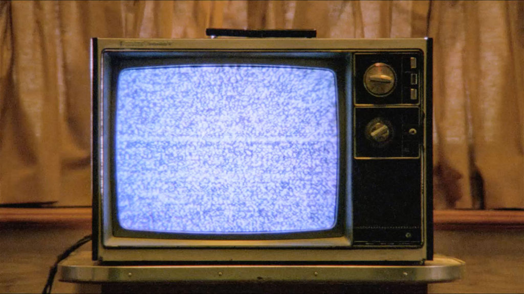 Zenith Solid State Colorchroma II television set with blue-hued static on the screen
