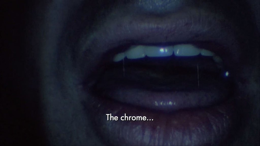An extreme close-up on a mouth with the word "The Chrome" subtitled