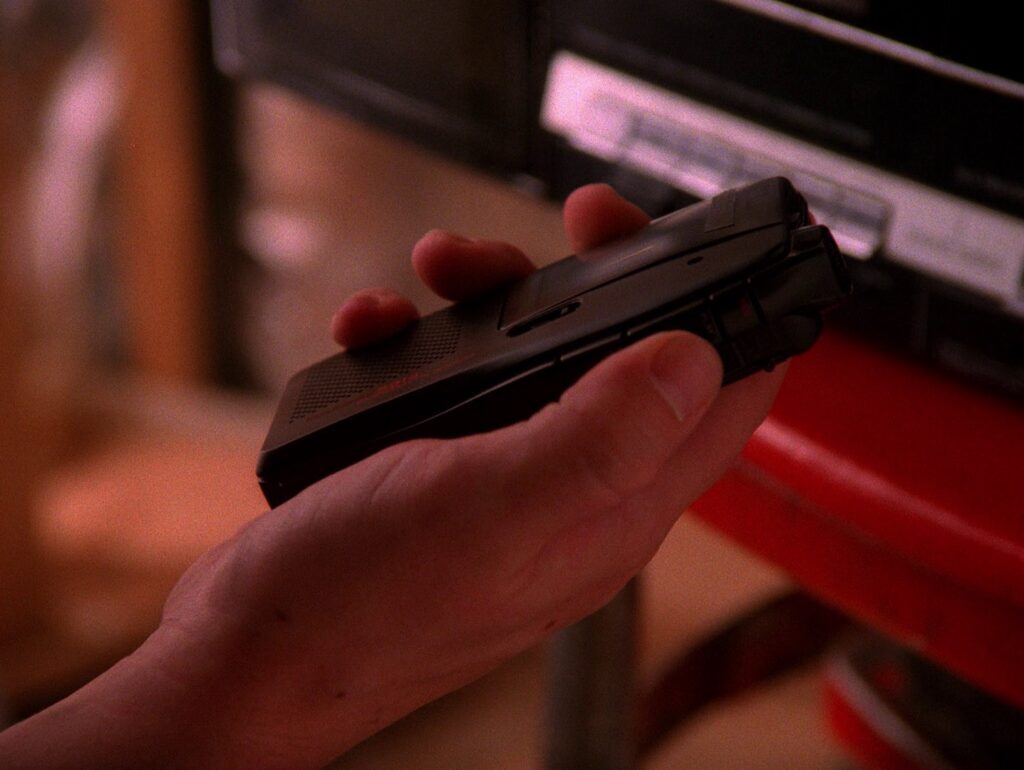 Bobby Briggs' hand holding the Olympus Pearlcorder