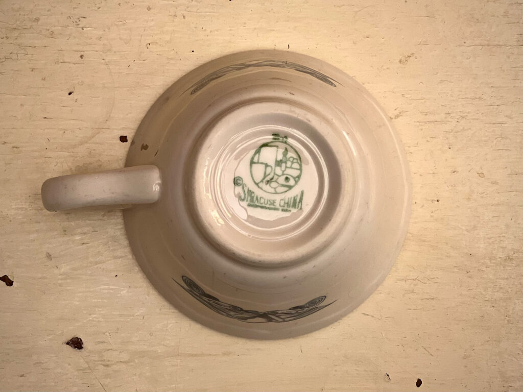 Bottom of White mug with Syracuse China label on bottom