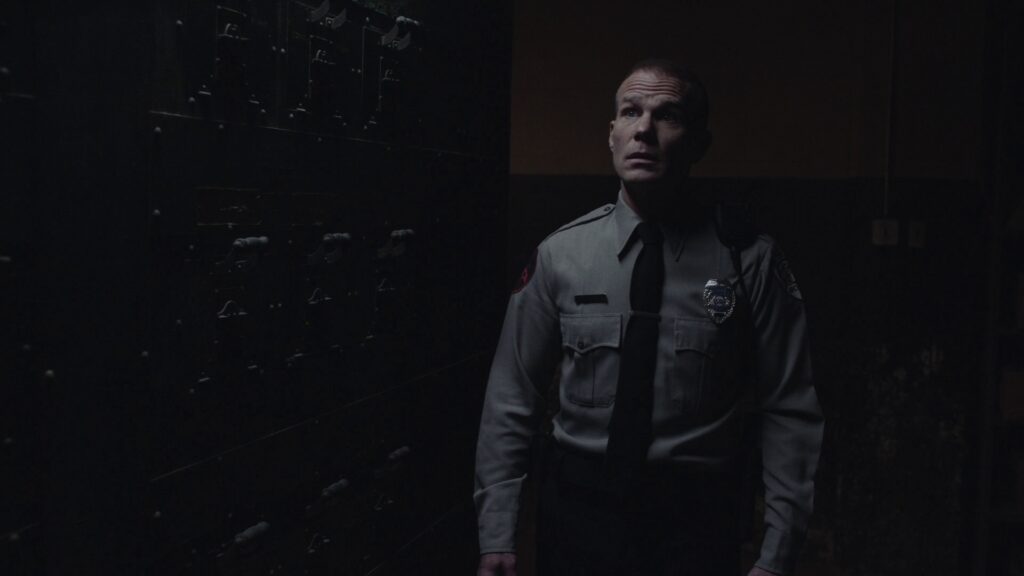 James Hurley in a Great Northern Hotel Security Guard Outfit in the boiler room