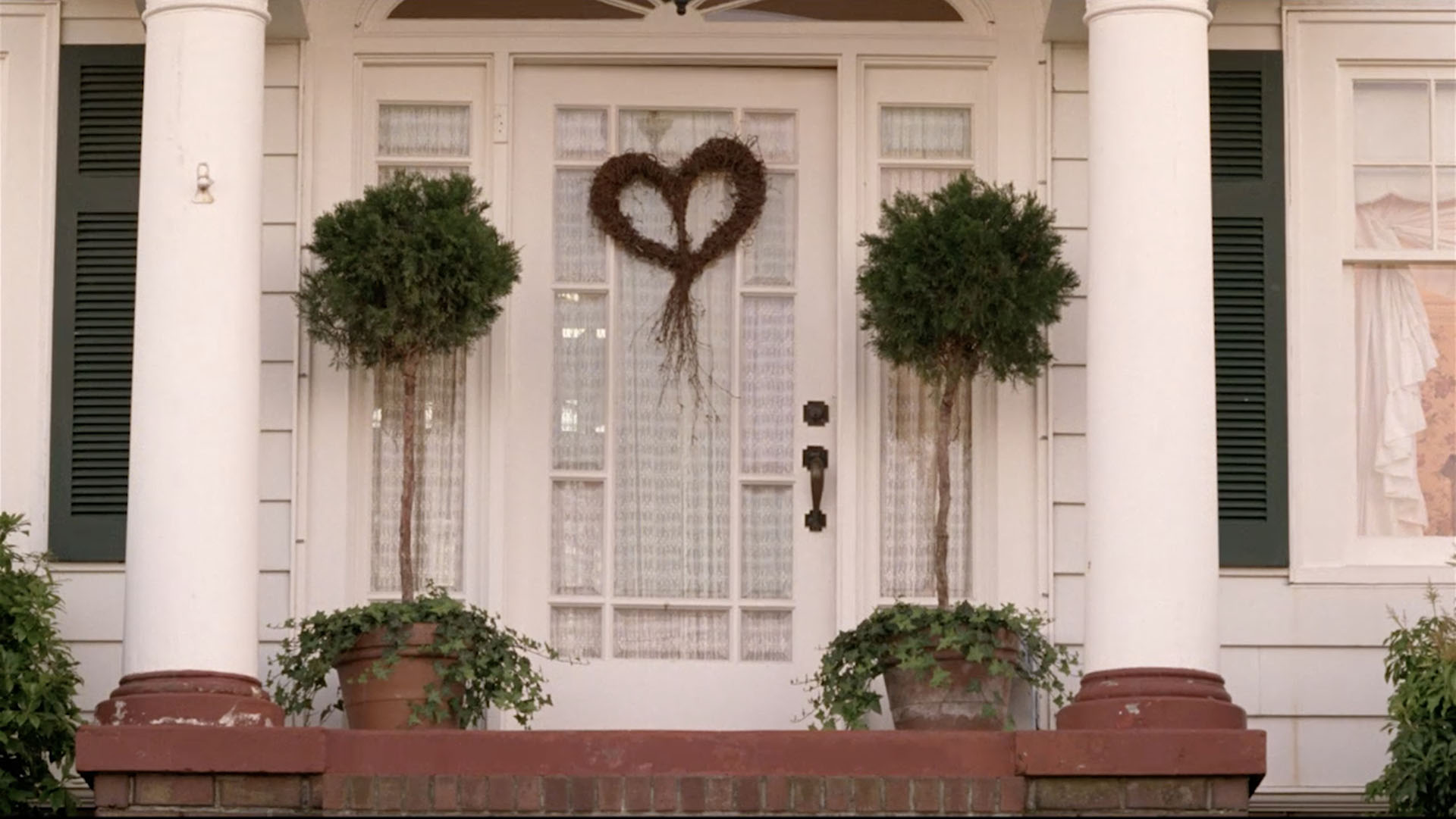 Heart shaped wreath on a front door