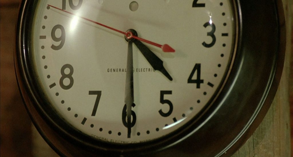 General Electric wall clock showing 4:30 p.m. as the time.