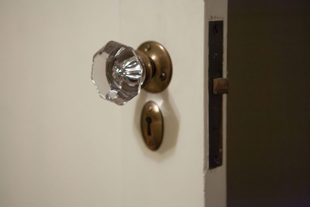 Door knob and keyhole on a white door