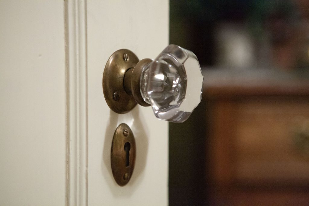 Door knob and keyhole on a white door