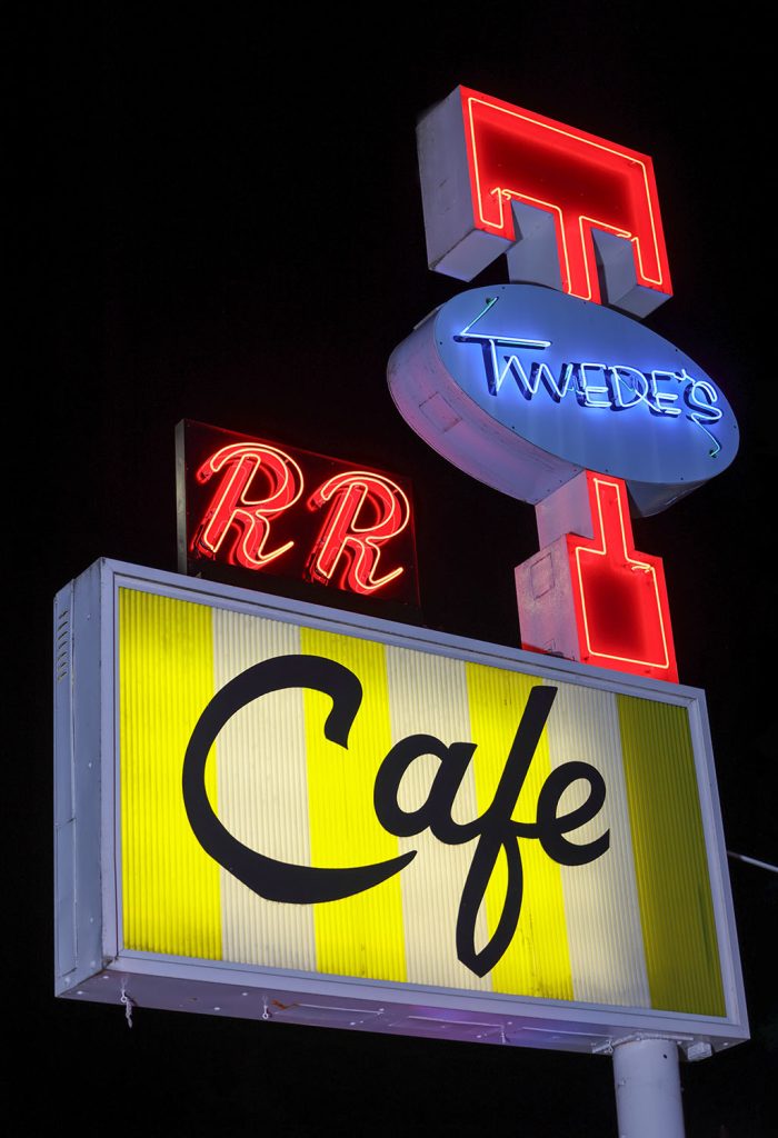 Twede's Cafe sign at night illuminated by neon