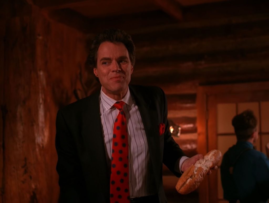 Ben Horne Standing while holding a baguette
