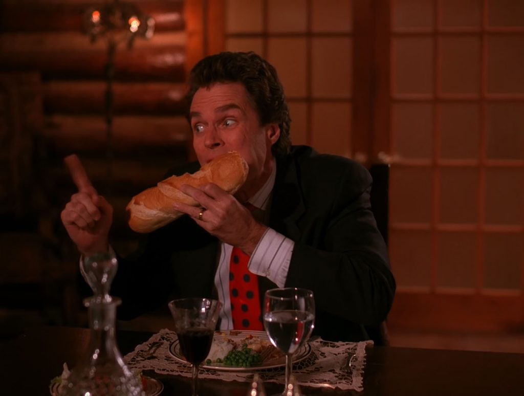 Ben Horne taking a bite out of a baguette