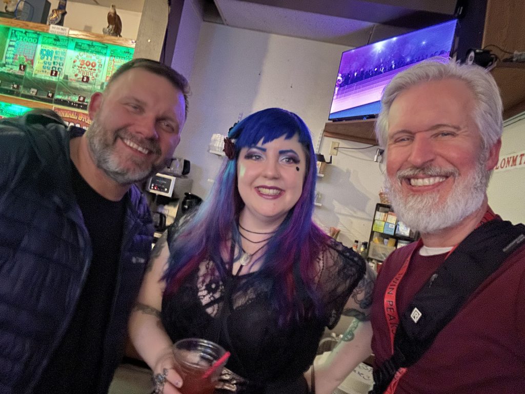 Three people smiling