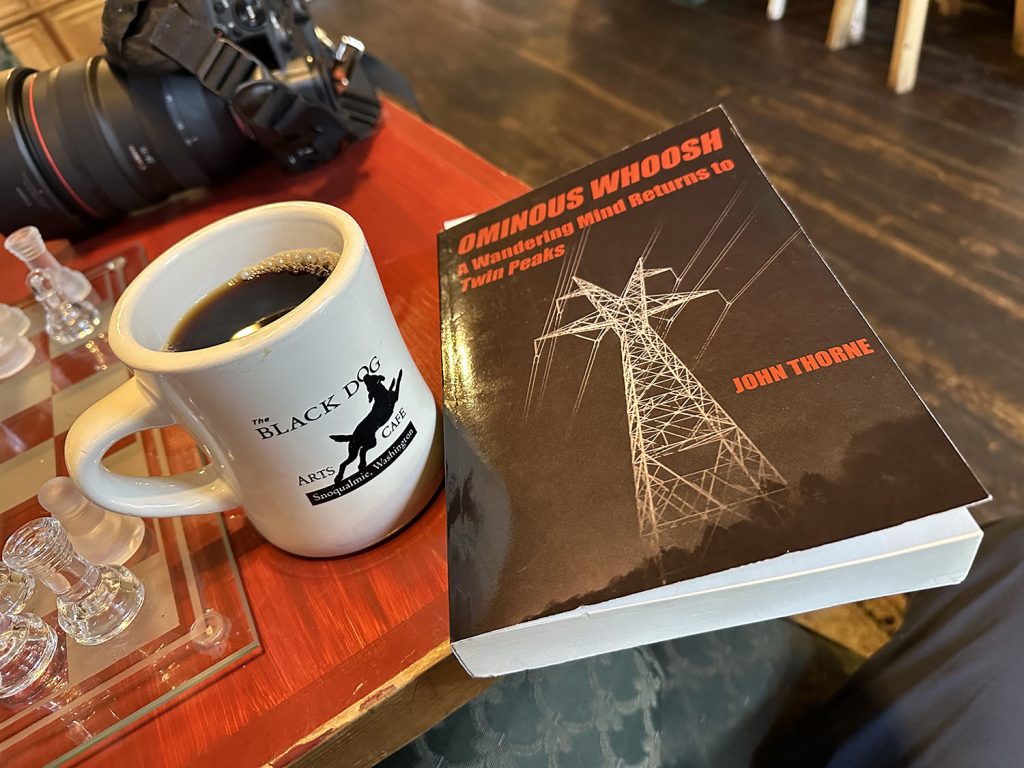 Coffee mug and book on a table