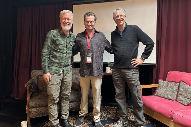 Steven Miller, Josh Eisenstadt and John Thorne standing on stage