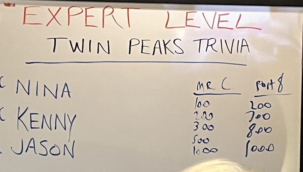 Expert Trivia scores on a dry erase board