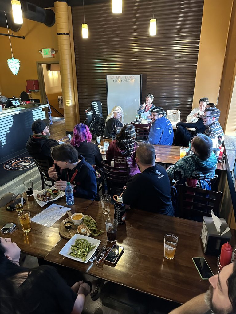 Josh facilitating trivia with attendees inside Snoqualmie Falls Brewery