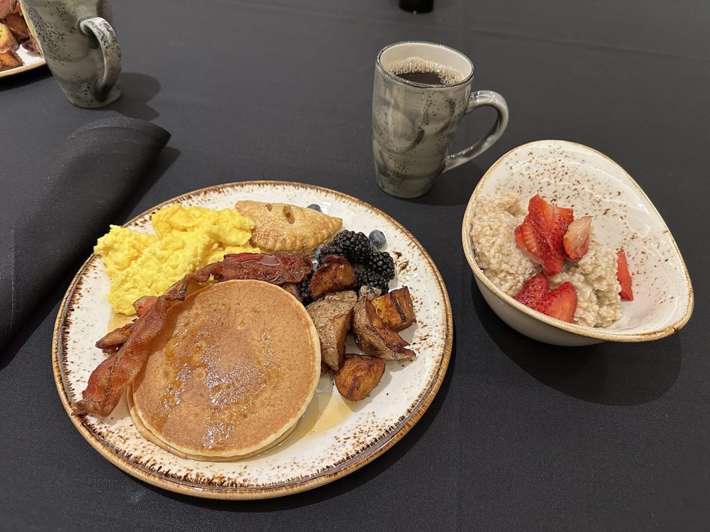 Breakfast plate with bowl of oatmeal and coffee