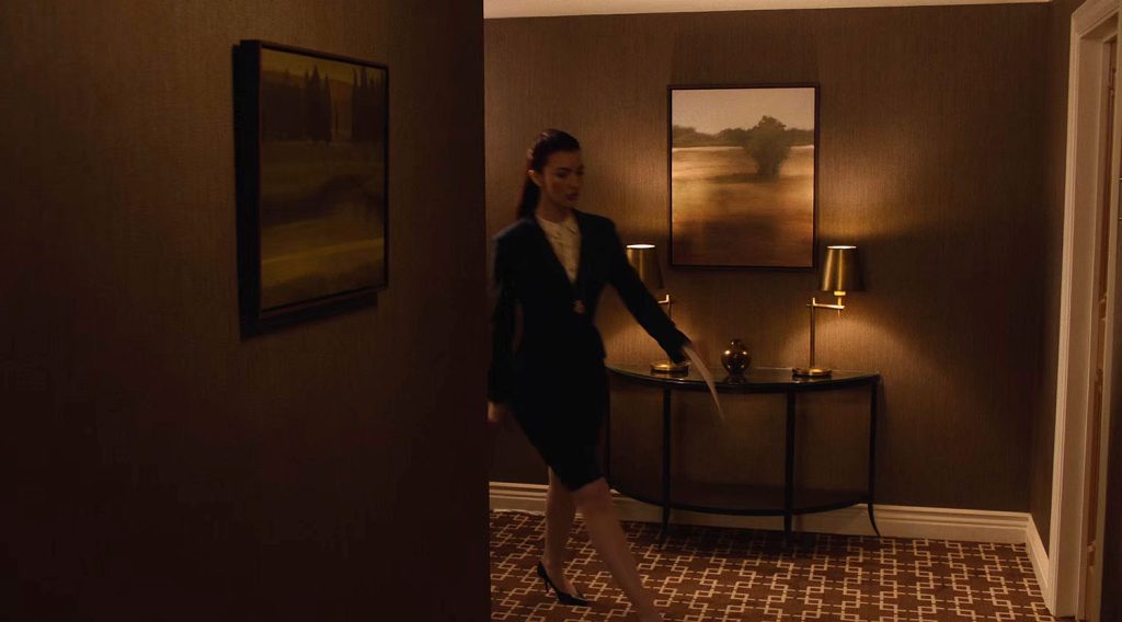 Agent Tammy Preston walking down Hotel hallway