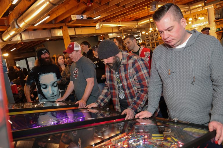 People playing pinball