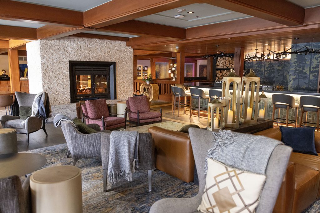 Lobby lounge at Salish Lodge and Spa with fireplace, chairs, tables and couches