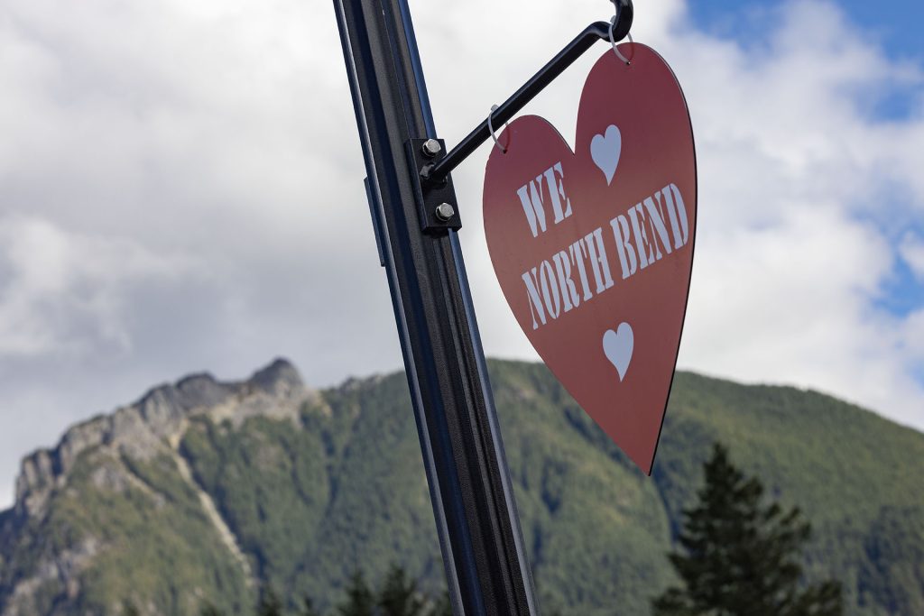 We Heart North Bend red heart on pole with Mount Si in distance