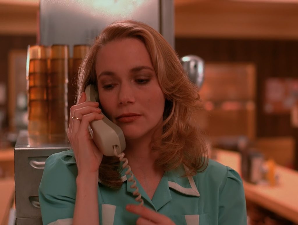 Norma Jennings in the Double R Diner speaking on the telephone