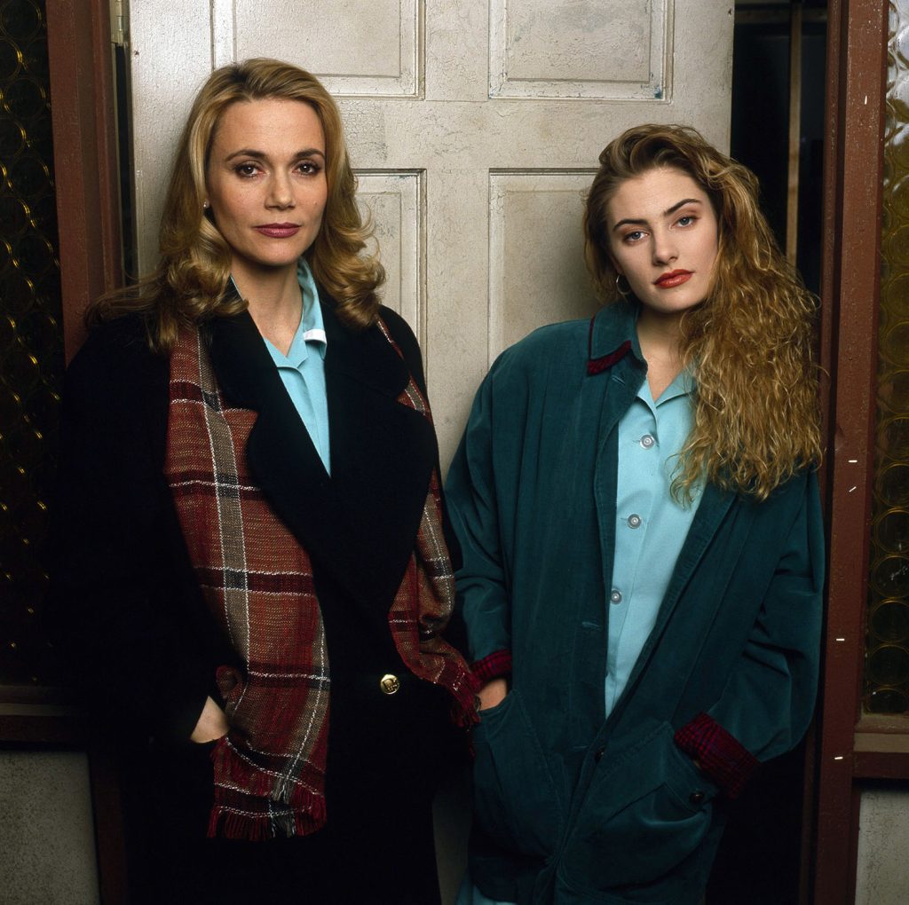 Shelly Johnson and Norma Jennings standing by a white door