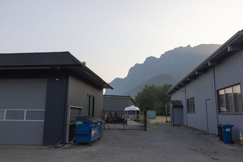 Mount Si in the morning between two buildings
