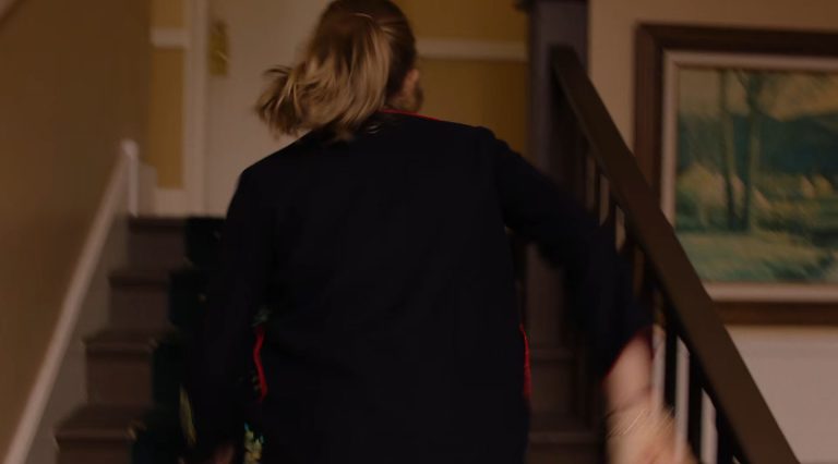 Becky Burnett running up stairs