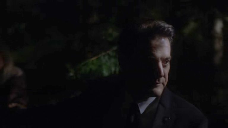 Cooper leading Laura through the woods